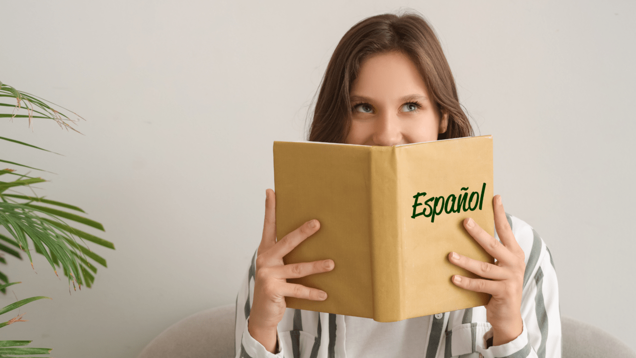 Self-directed Spanish learner reading at a café