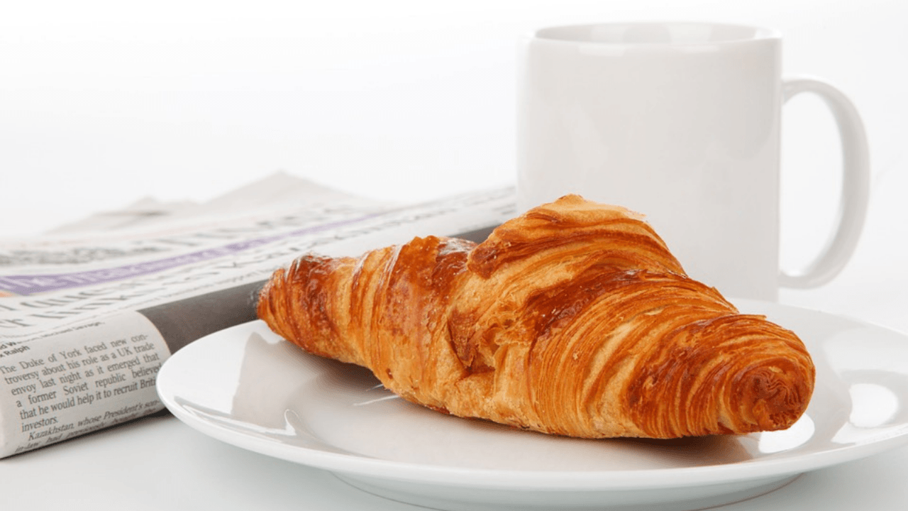 Newspaper and Croissant