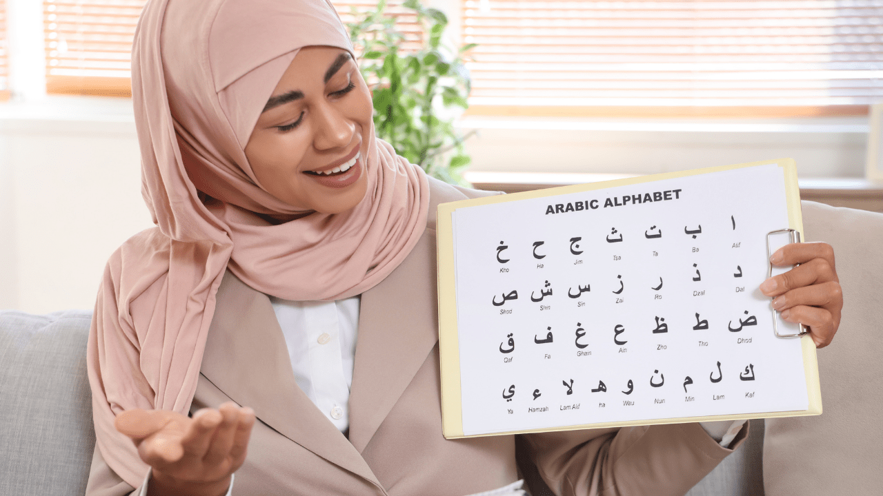 Woman teaching Arabic alphabet. 